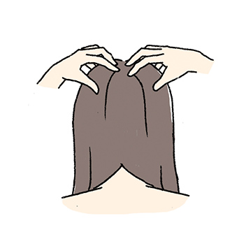 頭頂部をやさしく指圧